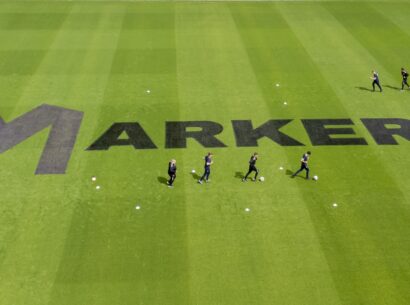Markers signage on the pitch at Bloomfield Road, home of Blackpool FC, in order to promote the National Football Museum, UK