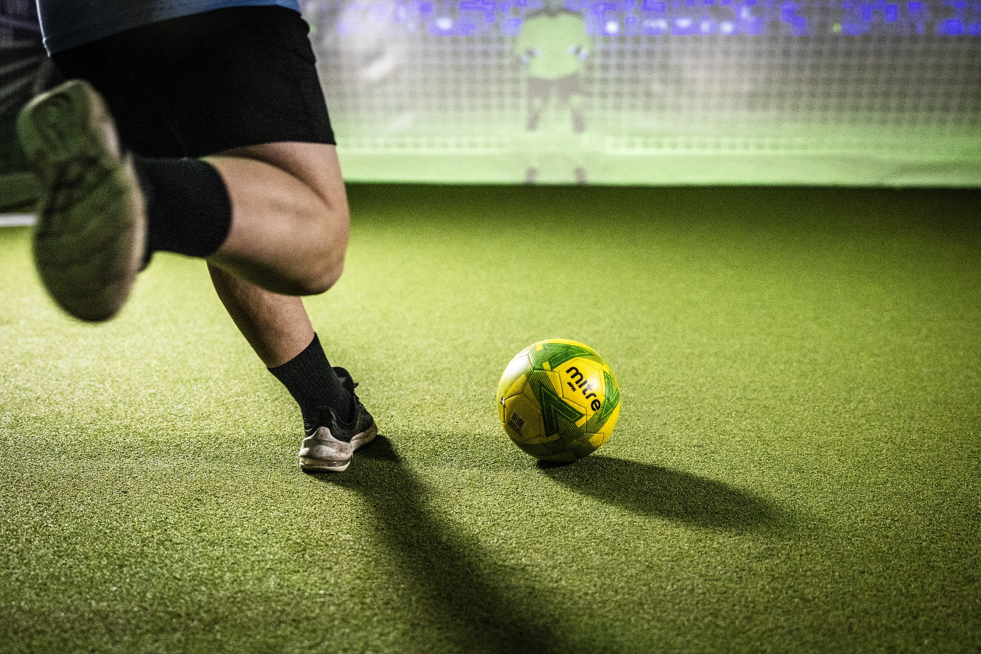 A football being kicked at the museum